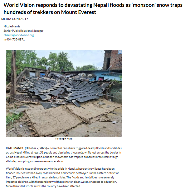 Collapsed building with scattered debris in front of a house, depicting flood damage in Nepal; overcast sky and greenery are visible in the background.