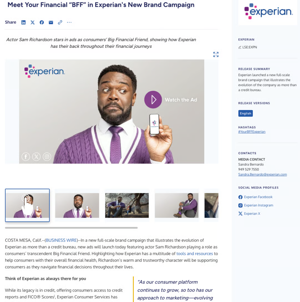 Actor Sam Richardson, holding a phone and wearing a suit, stands in front of an Experian logo backdrop as part of an Experian ad campaign.